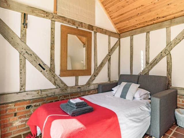 Hall area with sofa bed | Bakers Cottage, Hoxne, near Eye