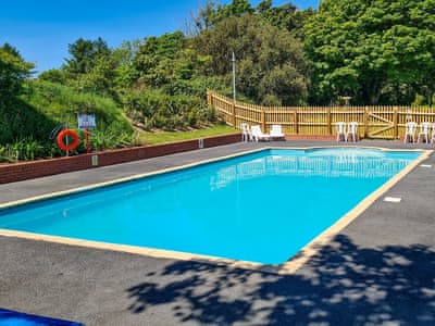 Shared heated Swimming pool | Honeysuckle Cottage, Willingcott Valley, Woolacombe