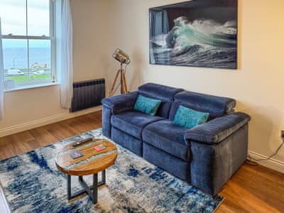 New sofa and coffee table in sitting area | Sea View 9, Whitby