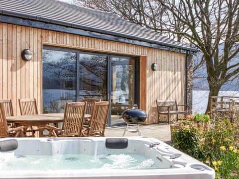 After exploring the local area, unwind in the luxurious hot tub  | Carsaig, Brig o&rsquo;Turk, near Callander