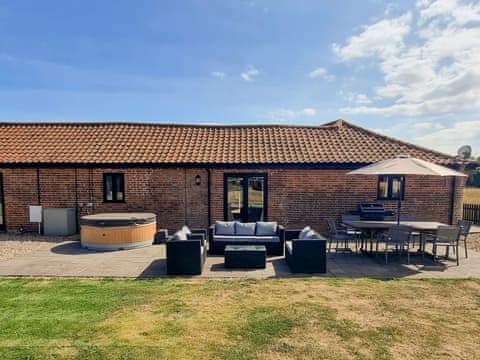 Relaxing, patio area | Summer House Stables, Catfield, near Stalham