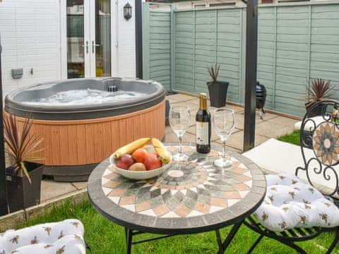 Furnished outdoor area with hot tub | The Beehive, Mundesley