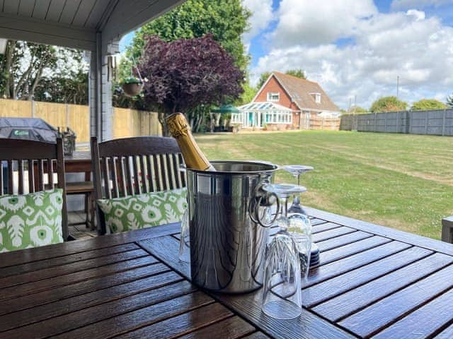 Summerhouse terrace overlooking the garden | Downsview Park - Downsview, Wick, near Littlehampton