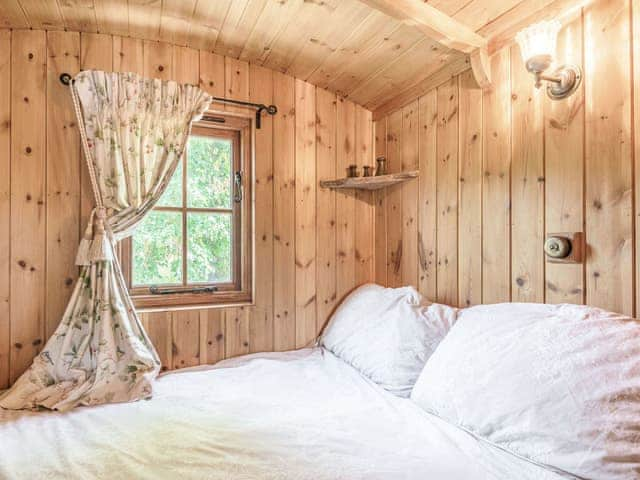 Bedroom | The Kingfisher - Longwool Shepherds Huts, Old Woodhall