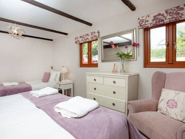 Ground floor family bedroom | Four Seasons Cottage, Torrington