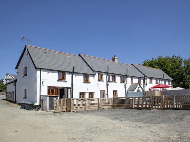 Exterior with parking area for 4-6 cars | Four Seasons Cottage, Torrington