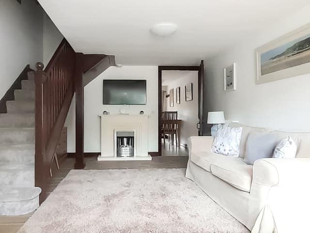 Airy living room with open staircase to first floor | Woodpecker Cottage - Wallace Lane Farm Cottages, Brocklebank, near Caldbeck and Uldale