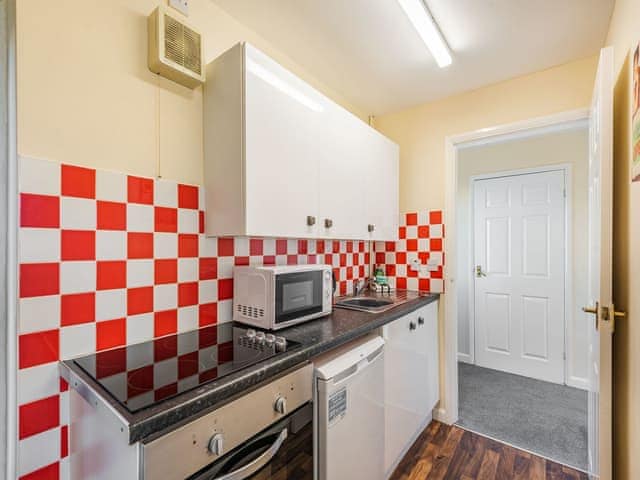 Kitchen area | Rainbow Bungalow 1 - Kings Caravan Park, Chapel St Leonards