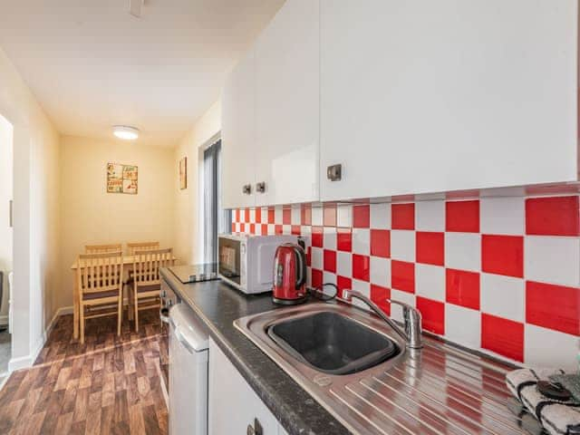 Kitchen/diner | Rainbow Bungalow 1 - Kings Caravan Park, Chapel St Leonards