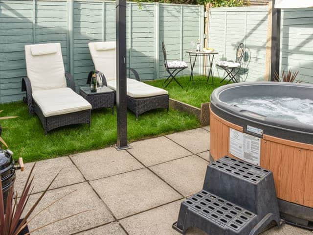 Furnished outdoor area with hot tub | The Beehive, Mundesley