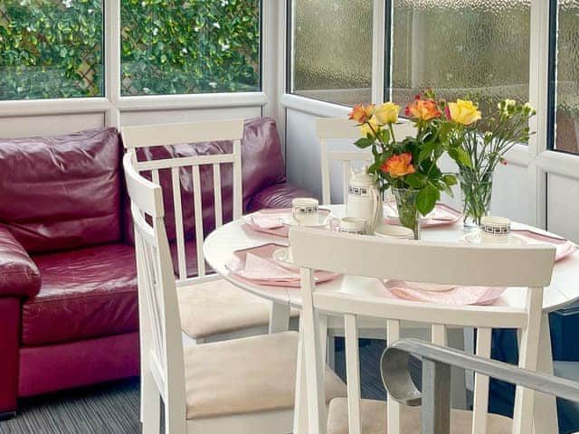 Dining area within the sun room | The Bay Cottage, Thornton-Cleveleys