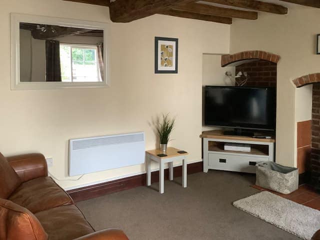 Characterful living room with a log burner, just what you need on a chilly evening! | Repton Cottage - Foremark Cottages, Milton, near Repton