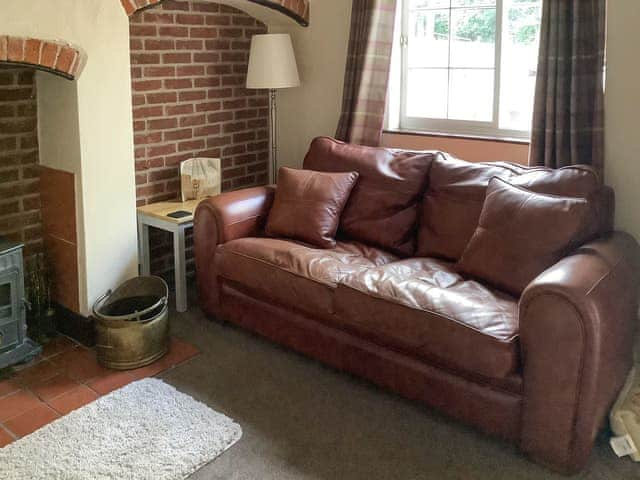 Cosy living room with log burner for those wintry evenings. | Repton Cottage - Foremark Cottages, Milton, near Repton