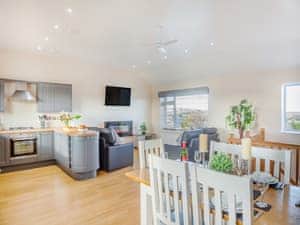 Open plan living space | Manawydan Cottage - Bryn Awel Caravan Park, Pentraeth