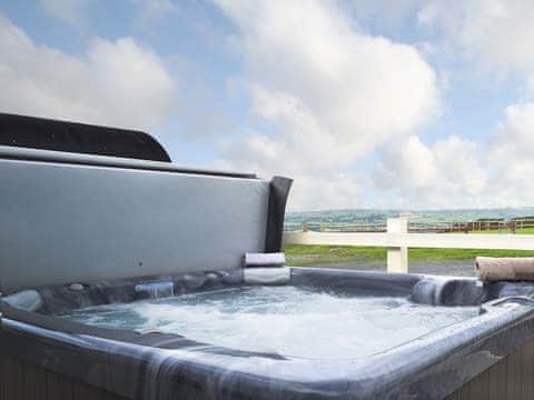 Take in the spectacular view from the hot tub  | Bunny Meadows, Llangynog, near Llansteffan