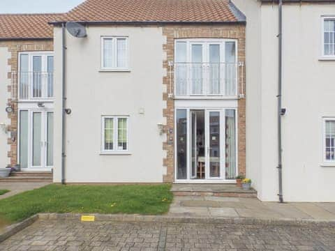 Property frontage with dedicated parking place and french door access  | Meadow View, Bridlington