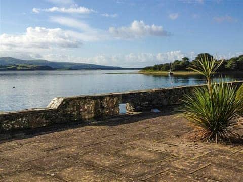 Shared patio area with sea view  | Estuary Flat With Views, Porthmadog