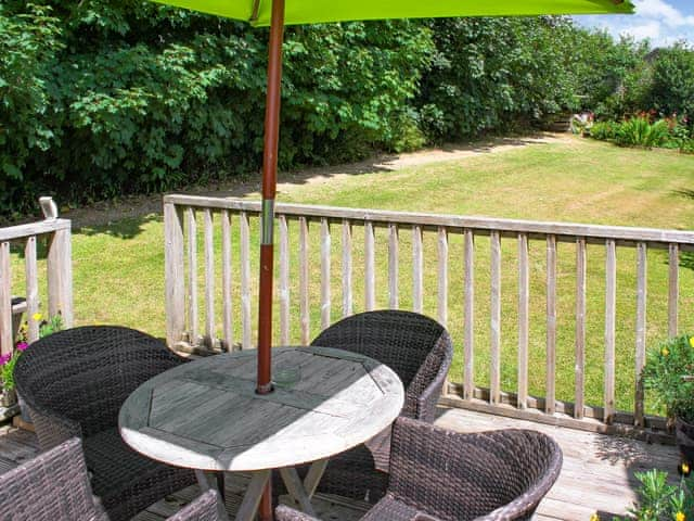 Private deck off lounge area with hot tub access and BBQ | Little Fursdon Apartment, Liskeard