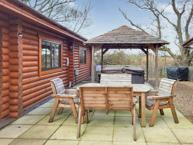 Outdoor area with hot tub | Tyne Log Cabin - Felmoor Park, Felton, near Morpeth