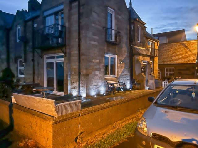 Exterior illuminated at night | The View Old Coastguard Cottage, Tynemouth