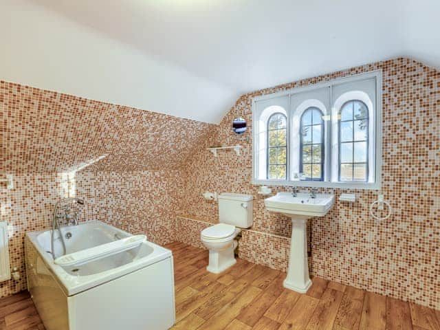 Bathroom 1 with bath, toilet and heated towel rail | Islington Hall, Tilney All Saints, near King&rsquo;s Lynn