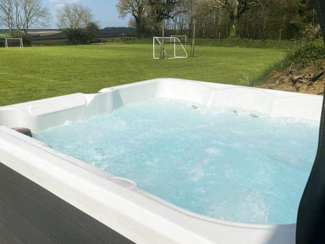 Hot tub | Tarka&rsquo;s Holt Log Cabin - Stowford Lodge Holiday Cottages, Langtree, near Great Torrington