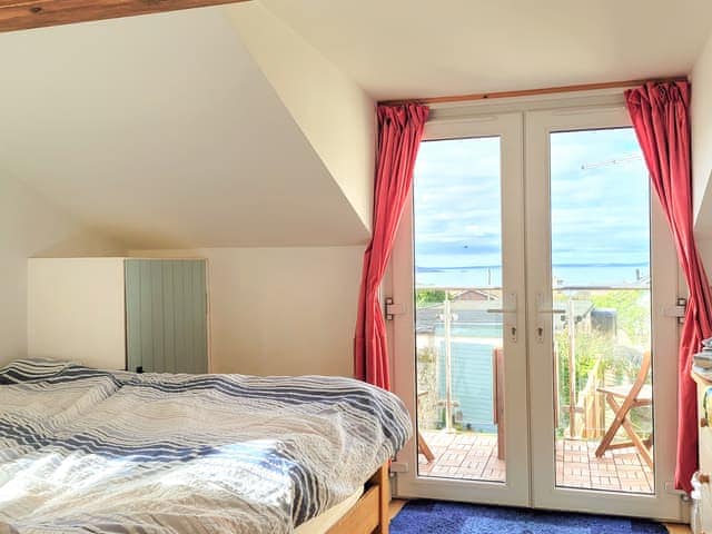 French door from bedroom to balcony | Honeysuckle Bay Cottage, Brixham