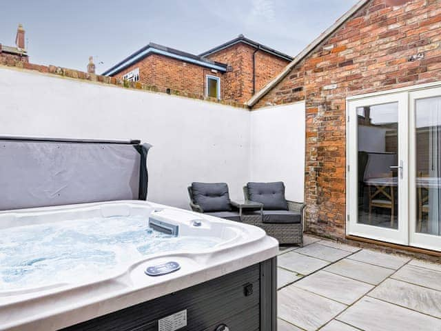 Outdoor area with hot tub | Royal Oak Cottages- Mr George - Royal Oak Cottages, Wainfleet, near Skegness