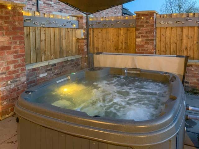 Coloured lights within the hot tub | White Heather Barn, Swanwick