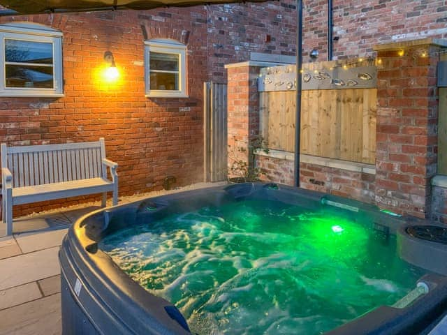 Coloured lights within the hot tub | White Heather Barn, Swanwick