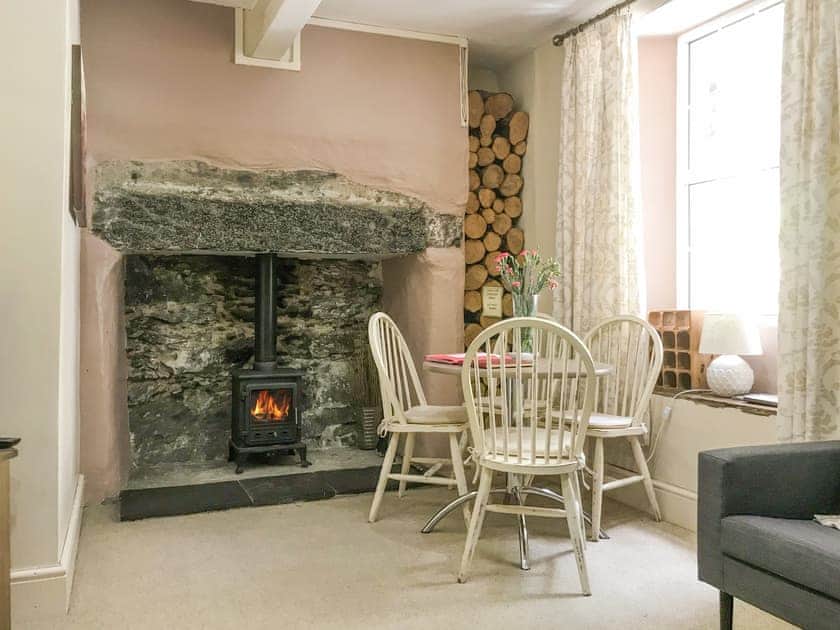 Dining area with log fire | Tryfan - Red Dragon Cottages, Beddgelert