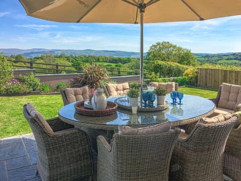 Sitting-out-area | Maes Y Bryn Farmhouse, Llansadwrn, near Llandeilo