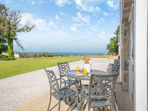 Sitting-out-area | Bryn Awelon Bach - Moelfre Cottages, Moelfre, near Benllech