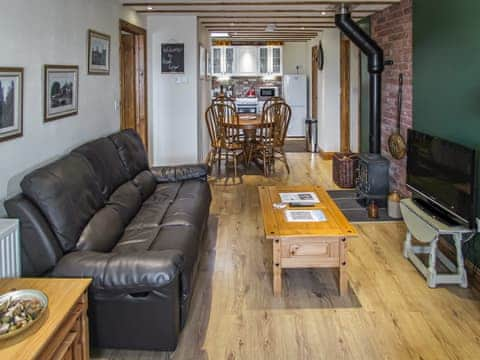 Wonderful open plan living space with exposed beams, cosy wood burner  | Reed Lodge - Wood Fen Lodges, Little Downham, near Ely