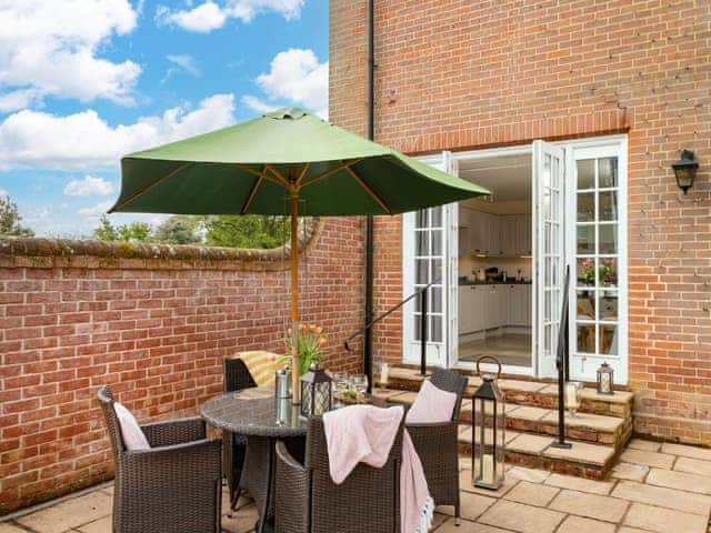 Outdoor furniture within patio area | Ground Wing - Gresham Hall Estate, Gresham, near Sheringham