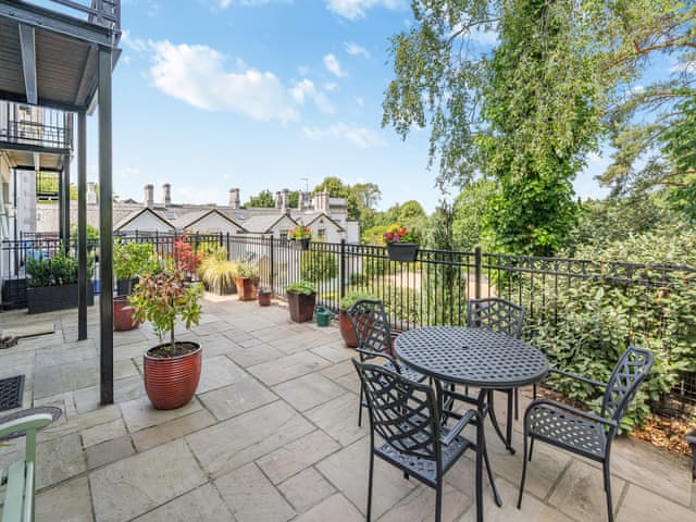 Relaxing patio with garden furniture | Apartment 14, Silverdale, near Arnside