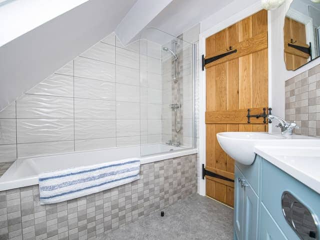 Family bathroom with shower over bath | The Weaning Shed, Huggate, near York