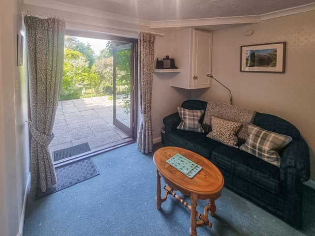 Additional ground floor seating area with French doors to garden | Harwood Dale Cottage, Kendal