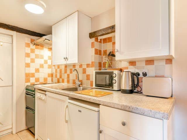 Well-equipped kitchen adjoins the living room | Foxglove Cottage - Laskill Grange, Bilsdale, near Helmsley