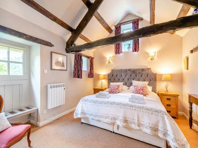 Peaceful double bedroom with exposed wood beams | Foxglove Cottage - Laskill Grange, Bilsdale, near Helmsley