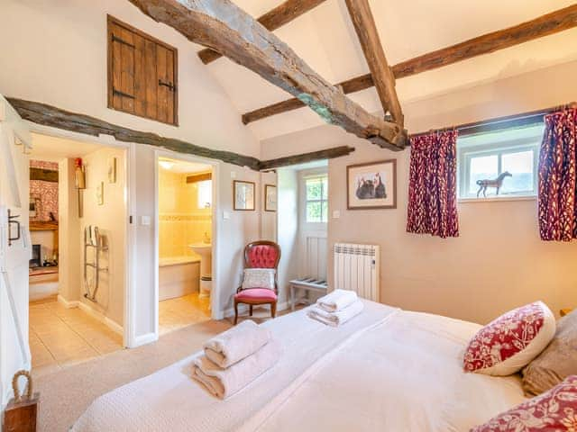 Peaceful double bedroom with exposed wood beams | Foxglove Cottage - Laskill Grange, Bilsdale, near Helmsley