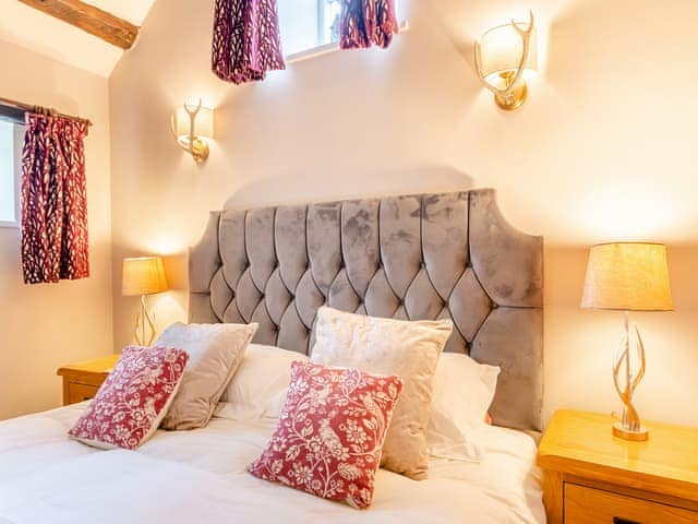 Peaceful double bedroom with exposed wood beams | Foxglove Cottage - Laskill Grange, Bilsdale, near Helmsley