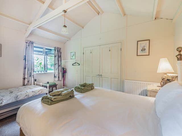 Family bedroom | Peaceful Woodland Lodge, Louth