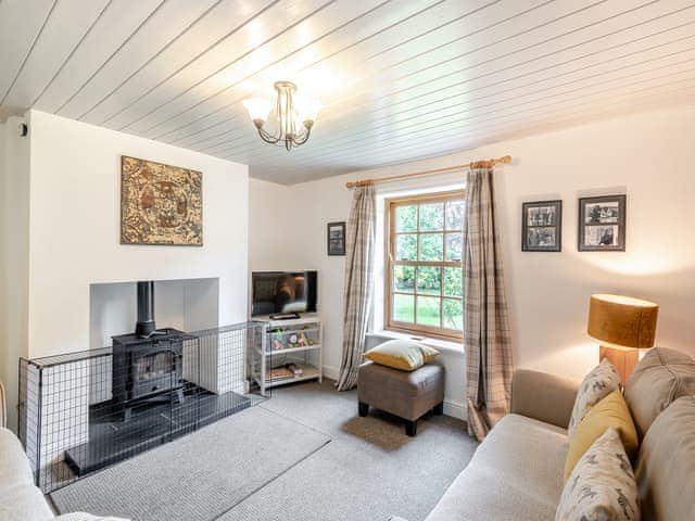 Sitting Room with woodburning stove | Peaceful Farmhouse - Mossop Farm Cottages, Marshchapel, near Louth