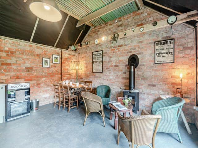 Kitchen/dining room with woodburner | Peaceful Travelers Rest - Mossop Farm Cottages, Marshchapel, near Louth