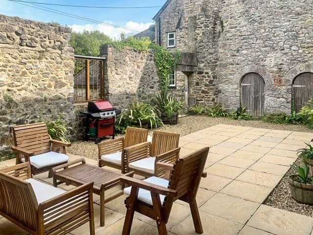 Private courtyard with outdoor furniture | Ringslade Barn and Cinema, Highweek, near Newton Abbot