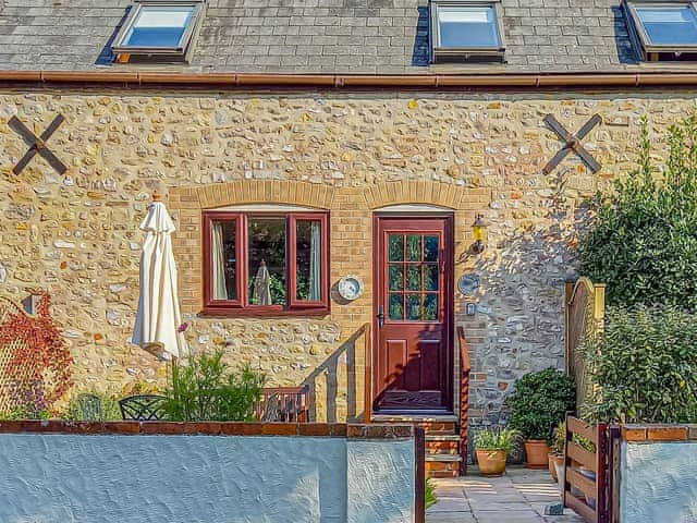 Cottage from the front with patio area  | Clouseau Cottage - Coppers Cottages, Lyme Regis