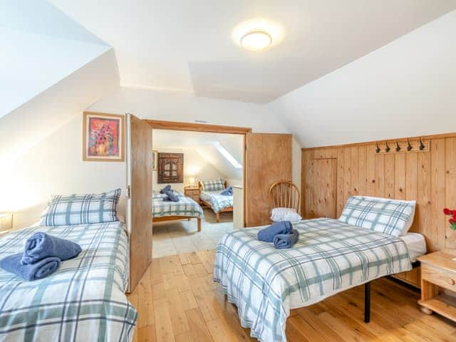 Twin bedroom with lake views and en suite cloakroom | Waters Reach, Pentney