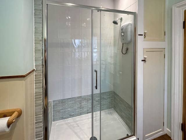 Shower room with double shower cubicle and electric shower | The Headmaster&rsquo;s Cottage, South Hill, near Tamar Valley