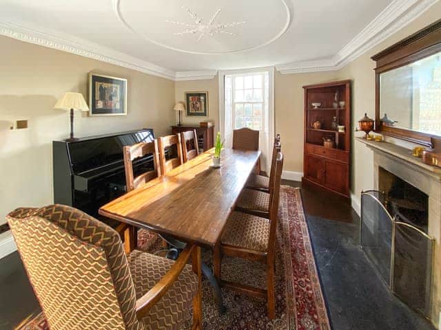 Dining room with piano and original open fire | Bradley Hall, Matlock